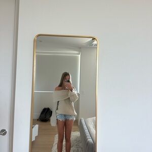 Off-Shoulder Cream Sweater with Denim Shorts
